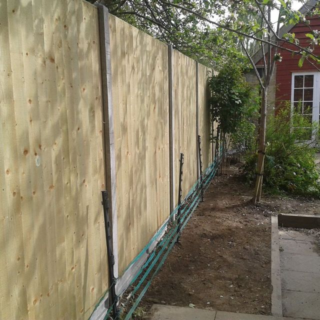Wood Fence Being Installed